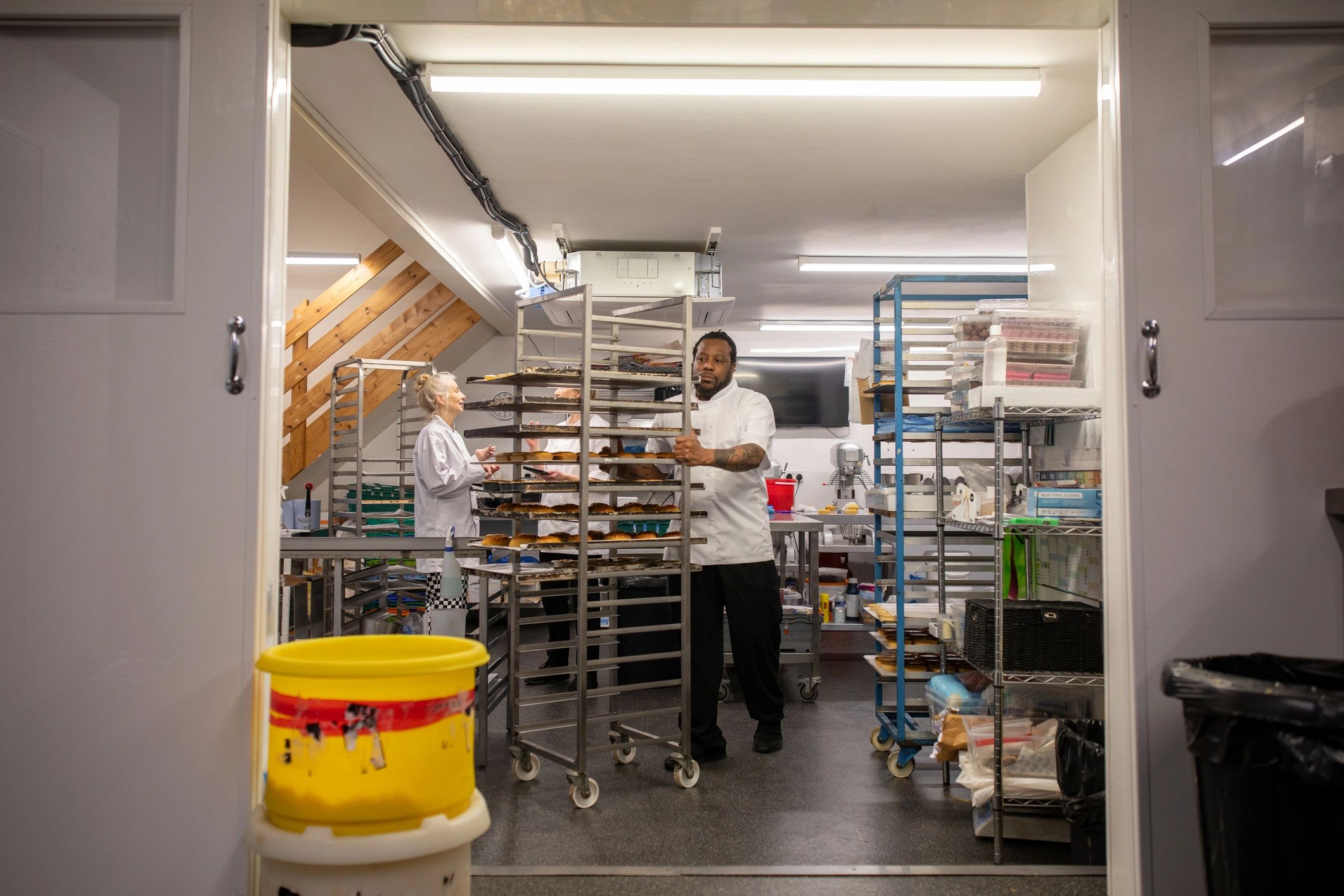 Operators working in a clean commercial kitchen production space